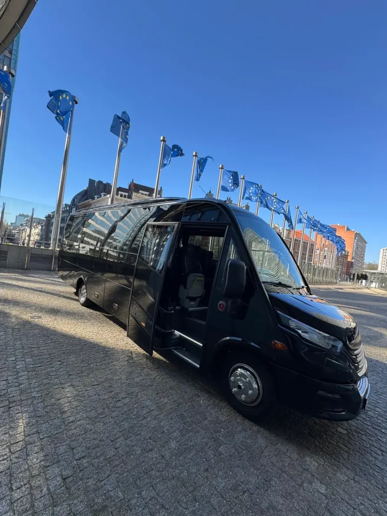 Black minibus with open door for group transport in Brussels